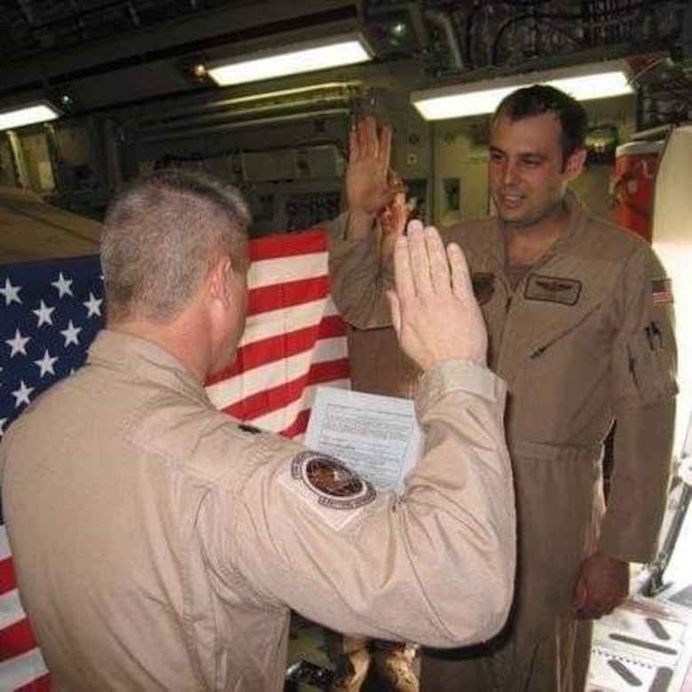 U.S. Air Force Master Sgt. Steven Gore re-enlists while deployed in Iraq in 2008.
