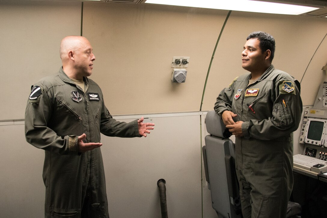 Two Airmen talking