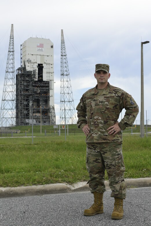 Master Sgt. Keith Carpenter, Space Launch Delta 45 Inspector General superintendent, stands in front of a space launch complex Aug. 9, 2021, at Cape Canaveral Space Force Station, Florida. Carpenter, who in 2020 was a 5th Space Launch Squadron spacecraft flight chief, won the Space Operations Command Space Launch Maintainer of the Year award in the senior noncommissioned officer category. (U.S. Space Force photo by Airman 1st Class Samuel Becker)
