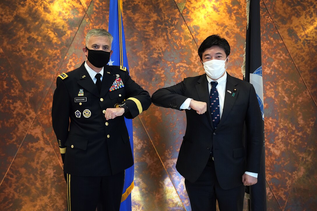 U.S. Army Gen. Paul M. Nakasone, U.S. Cyber Command commander and National Security Agency director, poses with the Honorable Yasuhide Nakayama, Japan Ministry of Defense, State Minister of Defense, at Fort George G. Meade, Md., Aug. 9, 2021