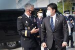 U.S. Army Gen. Paul M. Nakasone, U.S. Cyber Command commander and National Security Agency director, greets the Honorable Yasuhide Nakayama, Japan Ministry of Defense, State Minister of Defense, at Fort George G. Meade, Md., Aug. 9, 2021.