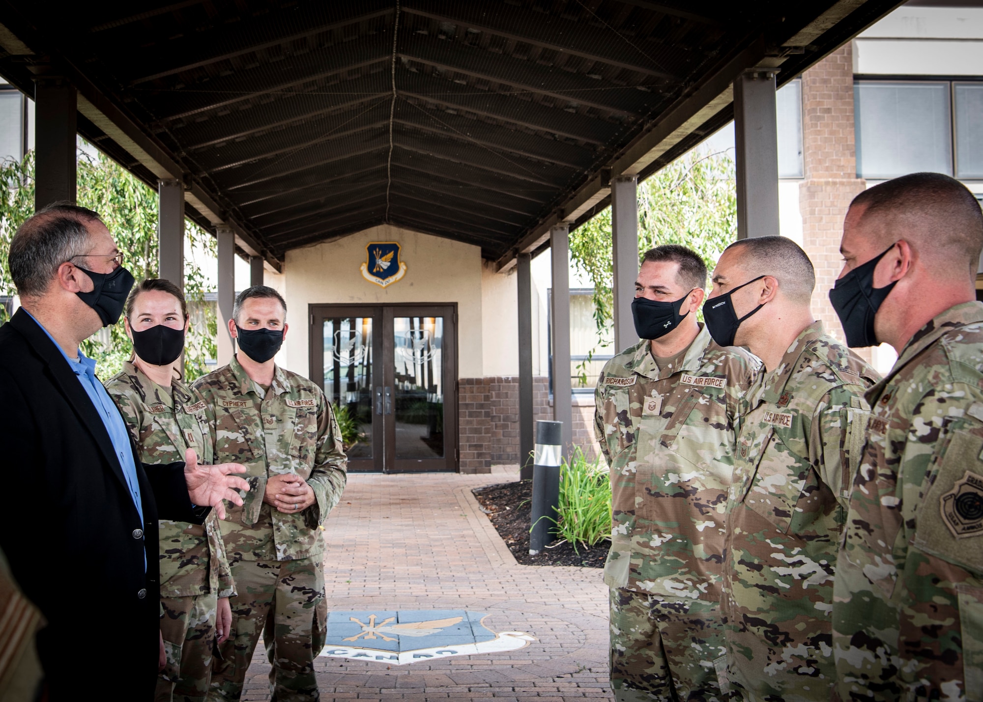 Photo of Airmen assigned to the 305th Maintenance Group welcoming Dr. Albert Lowas, Air Mobility Command chief scientist.