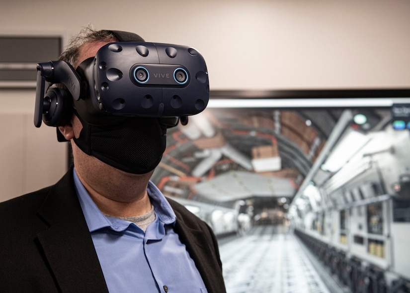 Photo of Dr. Albert Lowas using a virtual reality training aid.