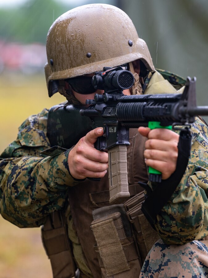 Cpl. Daniel O'Dell, a water support technician with with Combat Logistics Battalion 451, 4th Marine Logistics Group, posts security using a 3D-printed hand grip in the field during Northern Strike 21-2 at Camp Grayling, Michigan on Aug 8, 2021. Northern Strike is an annual exercise hosted by the National Guard aboard the National All-Domain Warfighting Center at Camp Grayling, MI. Reserve Marines with Combat Logistics Battalion 451 are providing direct and general support to Joint Task Force 85, increasing interoperability with sister services and integrating with the Active Component. (U.S. Marine Corps photo by Lance Cpl. Colby Bundy)