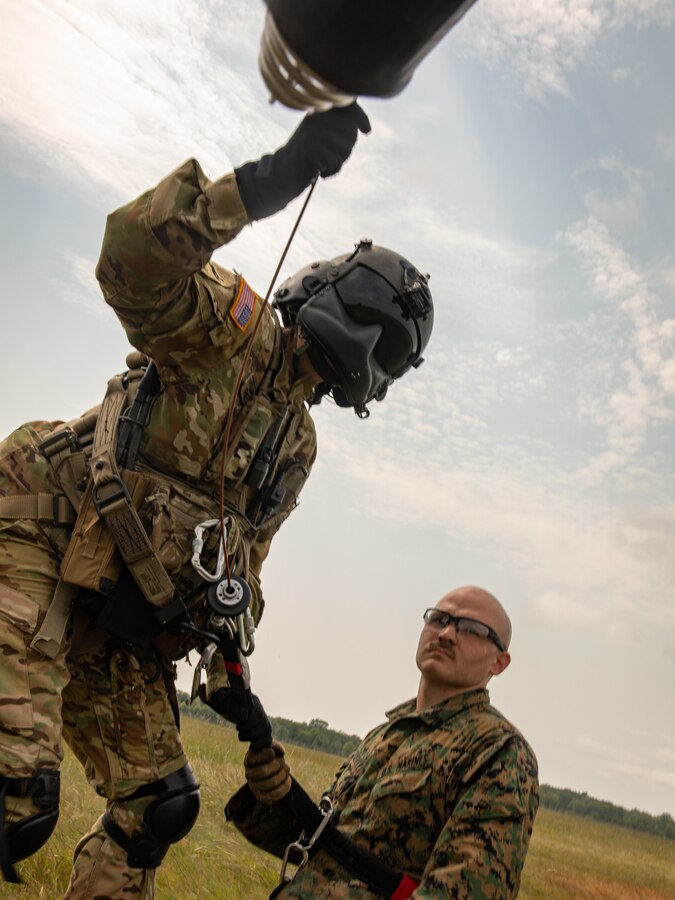 Cpl. Anthony Coccotelli a motor transport mechanic with Combat Logistics Battalion 451, 4th Marine Logistics Group practices casualty evacuation during Northern Strike 21-2 at Camp Grayling, Michigan on Aug 8, 2021. Northern Strike is an annual exercise hosted by the National Guard aboard the National All-Domain Warfighting Center at Camp Grayling, MI. Reserve Marines with Combat Logistics Battalion 451 are providing direct and general support to Joint Task Force 85, increasing interoperability with sister services and integrating with the Active Component. (U.S. Marine Corps photo by Lance Cpl. Colby Bundy)