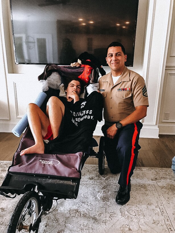 U.S. Marine Corps Staff Sgt. Anthony Sandoval, a recruiter with Recruiting Sub-Station Mission Viejo, Recruiting Station Orange County, poses for a photo with Peyton Forman, a local teenager with autism, in Mission Viejo, California on August 4, 2021. Sandoval wanted to personally meet with Peyton to get to know him and present him with a Marine Corps shirt. (U.S. Marine Corps photo taken by Sgt. Sarah Ralph)