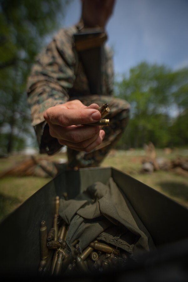 A U.S. Marine with Combat Logistics Battalion 451, 4th Marine Logistics Group, loads blanks during Northern Strike 21-2 at Camp Grayling, Michigan on Aug. 7, 2021. Northern Strike is an annual exercise hosted by the National Guard aboard the National All-Domain Warfighting Center at Camp Grayling, MI. Reserve Marines with Combat Logistics Battalion 451 are providing direct and general support to Joint Task Force 85, increasing interoperability with sister services and integrating with the Active Component. (U.S. Marine Corps photo by Cpl. James Stanfield)