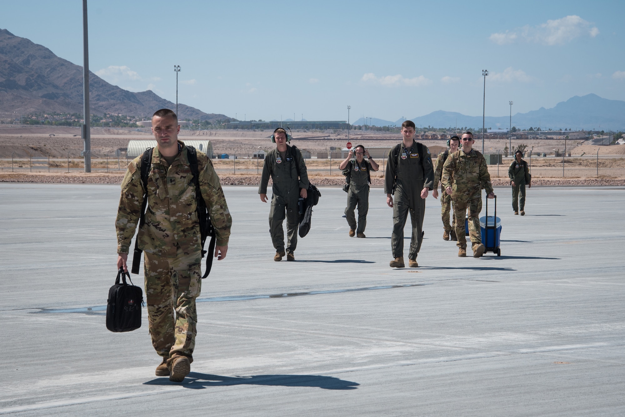 aircrew members walking to the jet
