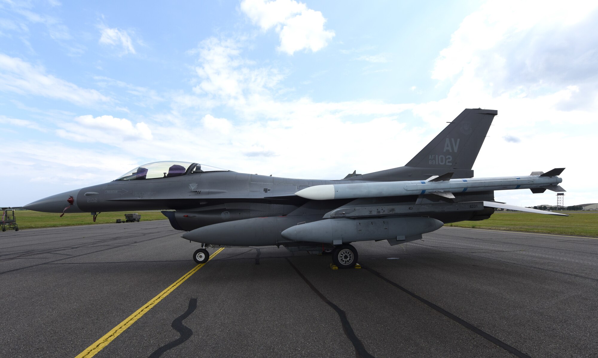 A U.S. Air Force F-16 Fighting Falcon aircraft assigned to the 31st Fighter Wing, Aviano Air Base, Italy, sits on the flightline at Royal Air Force Mildenhall, England, Aug. 3, 2021. The F-16 is a compact, multi-role aircraft which is maneuverable and has proven itself in air-to-air combat and air-to-surface attack. (U.S. Air Force photo by Karen Abeyasekere)