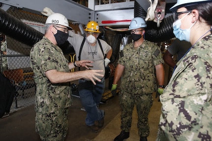 SurgeMain East Regional Executive Officer Captain Jonathan Jett-Parmer meets with SurgeMain Sailors and shipyard personnel during a visit to Norfolk Naval Shipyard.