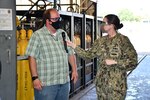 Code 930 Additive Repair Zone Manager Nick Allen shares the recent efforts of the Cold Spray Team with Norfolk Naval Shipyard Commander, Capt. Dianna Wolfson, during the filming of the fifth episode of America’s Shipyard