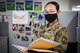 Airman 1st Class Ling Yu, 66th Comptroller Squadron financial accounting technician, reviews financial management study materials at her desk at Hanscom Air Force Base, Mass., Aug. 10. Yu studied English and American history to obtain her U.S. citizenship on July 23, and is now studying to achieve her professional upgrade training as an Airman. (U.S. Air Force photo by Lauren Russell)