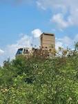 Soldiers with the 197th Field Artillery Brigade, New Hampshire Army National Guard, set up their AN/TPQ-53 Firefinder Radar during Northern Strike 21, Camp Grayling Joint Maneuver Training Center, Grayling, Michigan, Aug. 8, 2021.