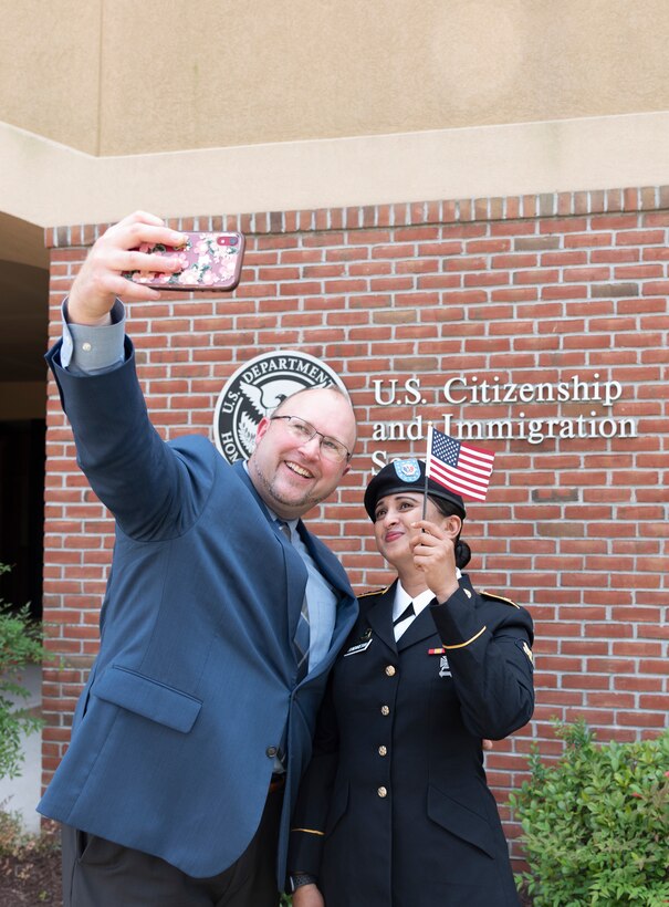 Virginia Army National Guard Soldier Spc. Sri Siri Sundaresan Arumugam, assigned to Maneuver Training Center Fort Pickett, becomes a U.S. citizen July 29, 2021, at the U.S. Citizenship and Immigration Services Field Office in Norfolk, Va. Sundaresan Arumugam, a native of India, joined the Army National Guard in April 2019 and was assigned to Fort Pickett in October 2020 after completing Army Basic Combat Training and Advanced Individual Training. (U.S. Army National Guard photo by Staff Sgt. Lisa M. Sadler)