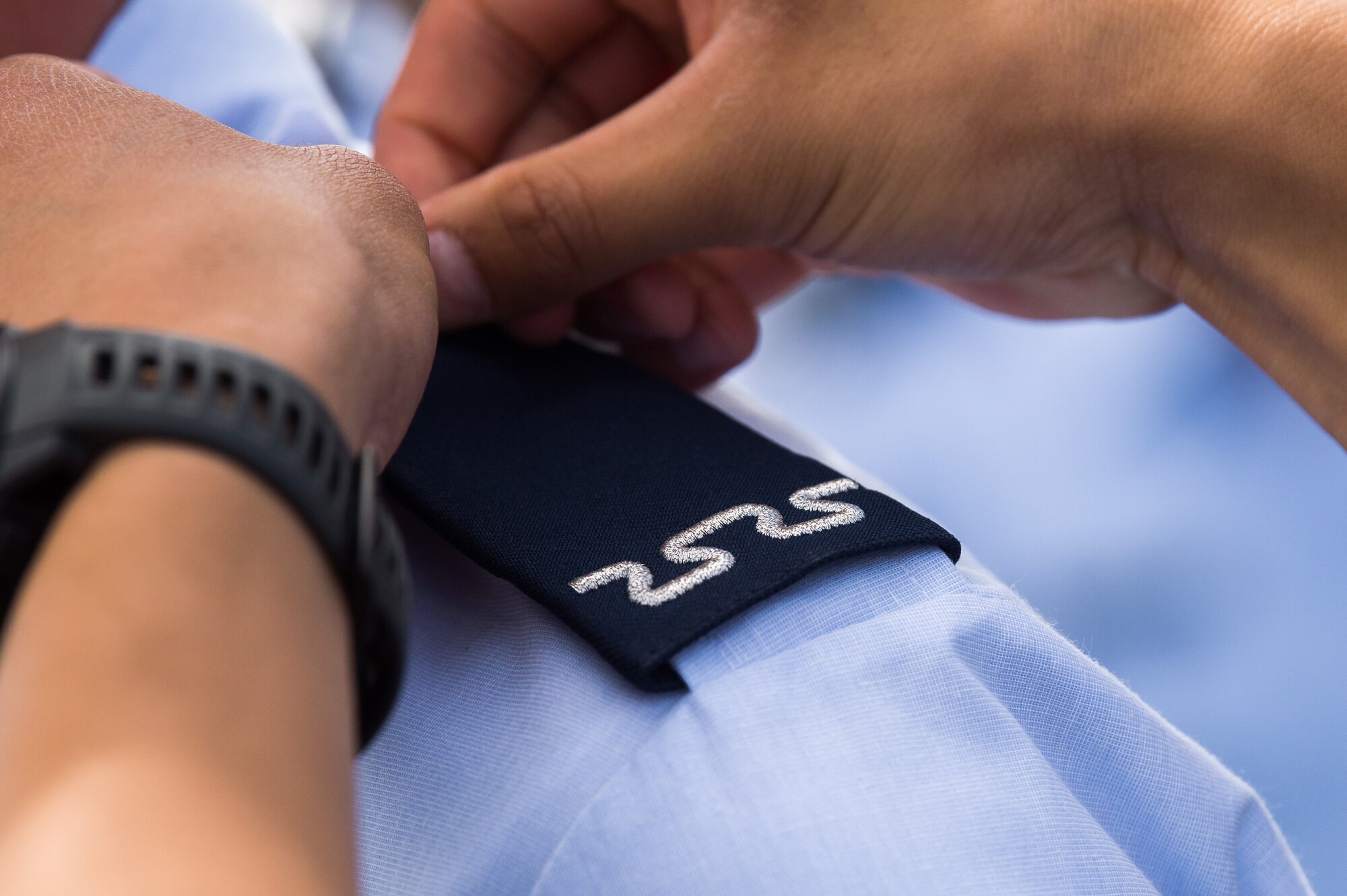 A fourth-class cadet receives their shoulder board during the U.S. Air Force Academy’s Acceptance Day ceremony at Stillman Parade Field