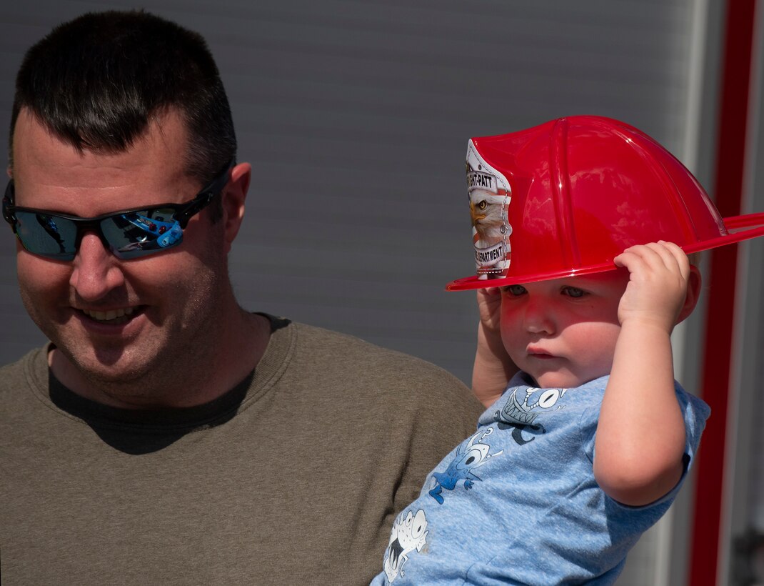 Father and son attend National Night Out at Wright-Patterson Air Force Base.