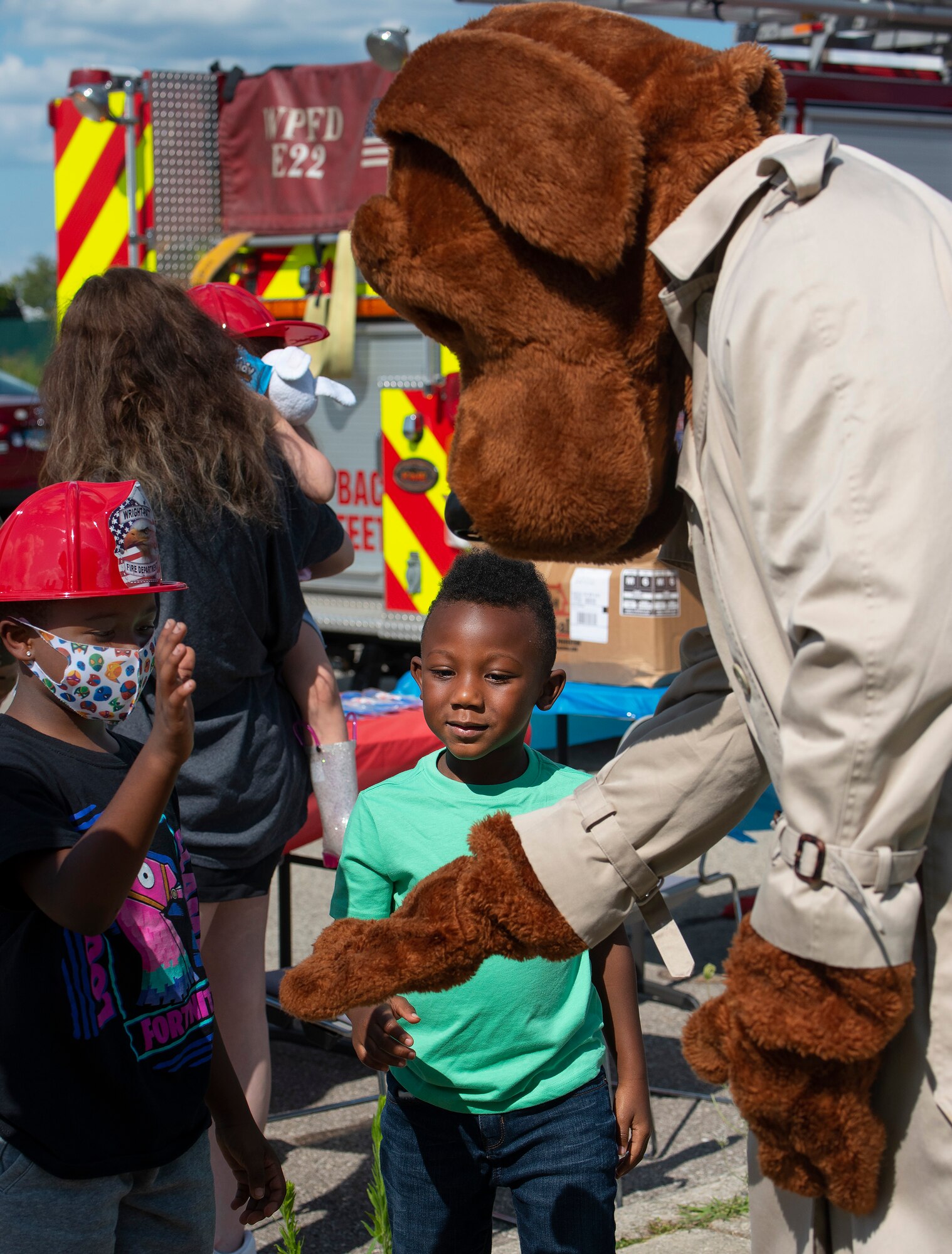 Kids meet McGruff the Crime Dog during National Night Out at Wright-Patterson Air Force Base.