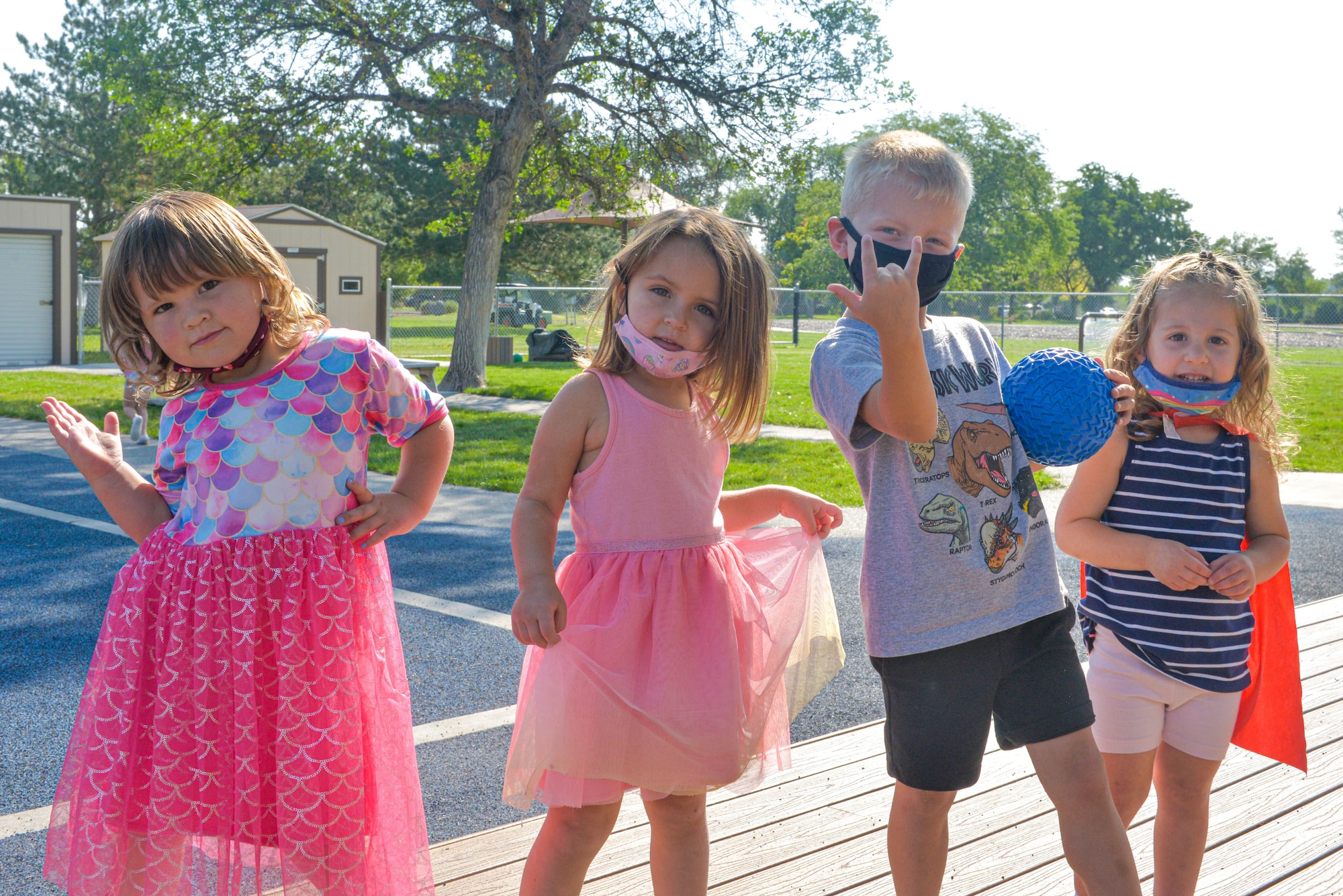 Four children pose for the camera during recess on Mountain Home Air Force Base, Idaho.