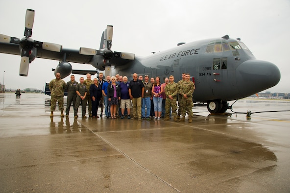 Employers pose next to a 934th Airlift Wing C-130H during Employer's Day at at Minneapolis-St. Paul Air Reserve Station, Aug. 30, 2021. (Air Force photo by Chris Farley)