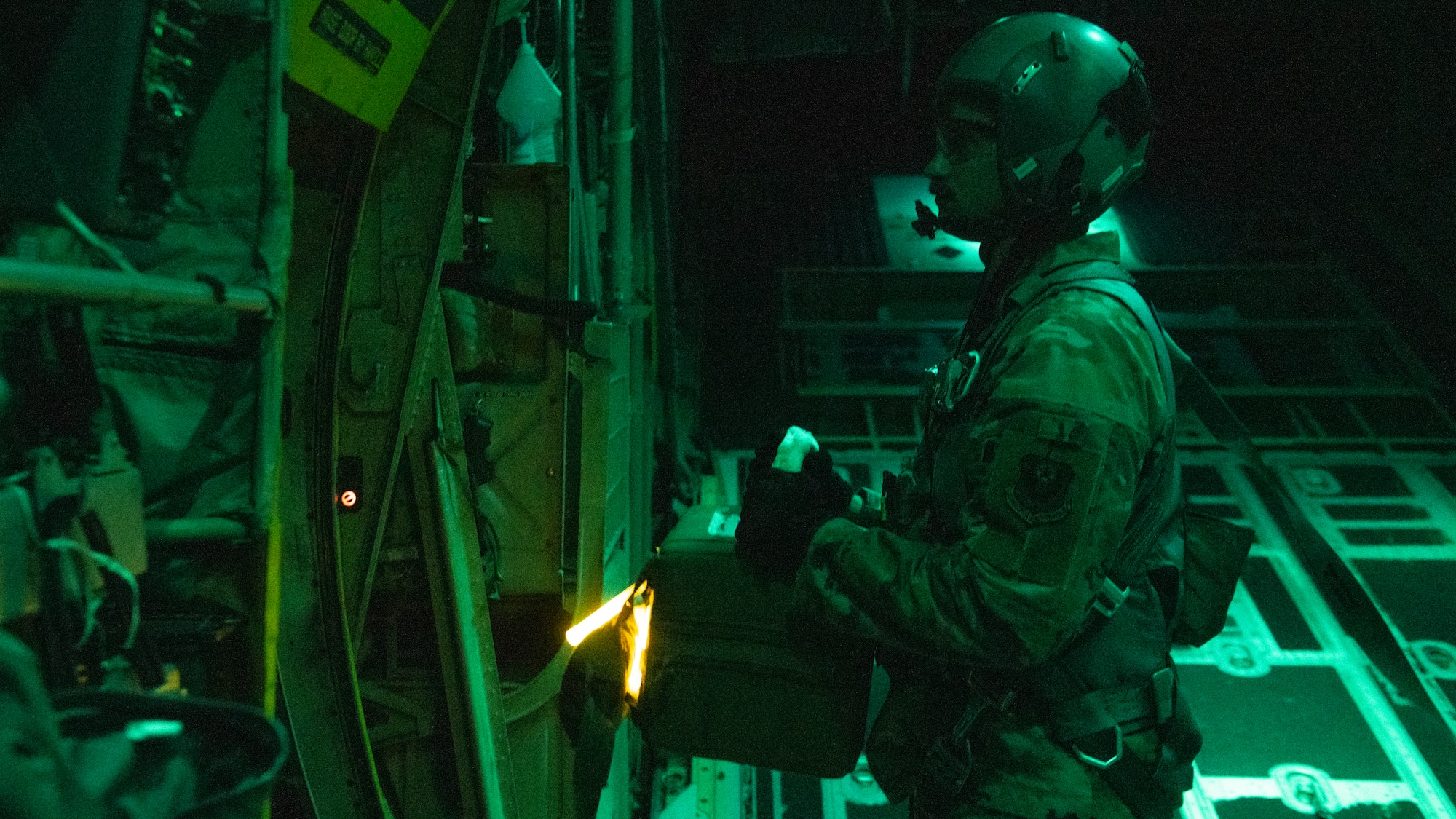 U.S. Air Force Tech. Sgt. John Richman, a 492nd Special Operations Training Group loadmaster, prepares to drop a thermal blood transport box during Operation Blood Rain near Eglin Range, Florida, Aug. 5, 2021.