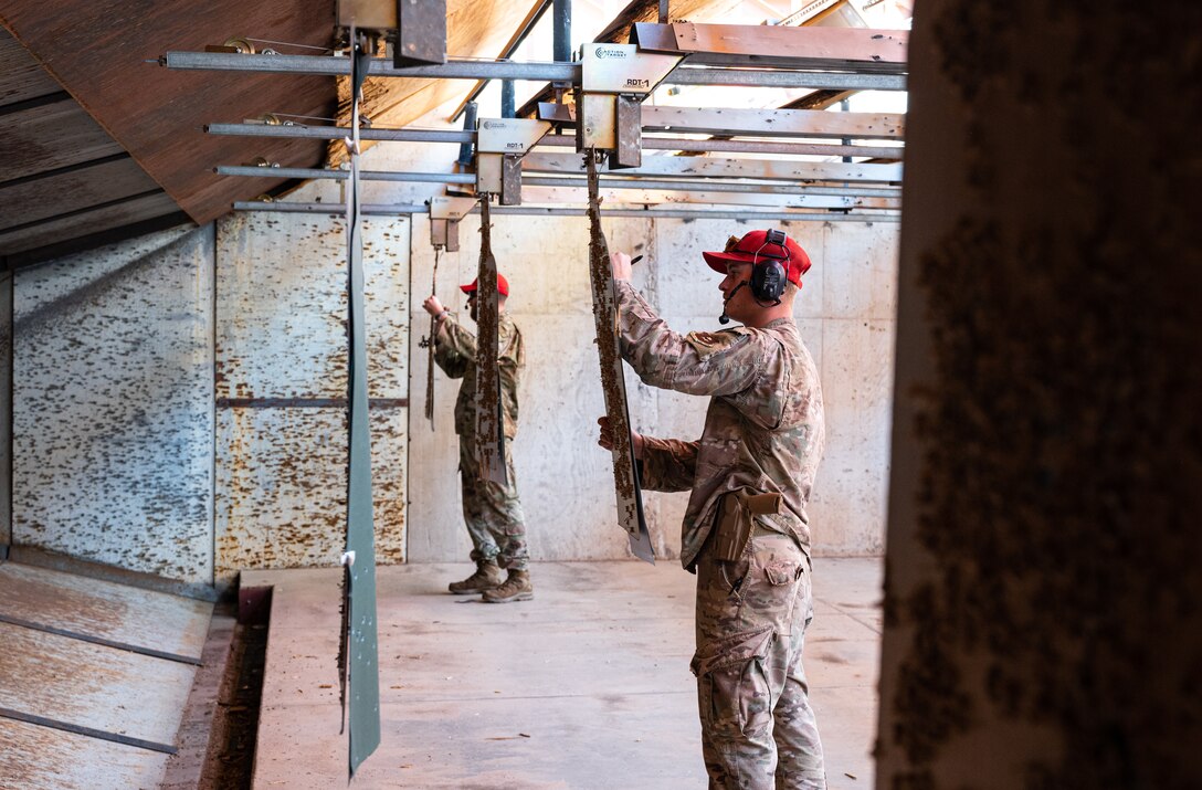 U.S. Air Force Airman 1st Class Adam Sutherby, 56th Security Forces Squadron Combat Arms Training and Maintenance instructor, evaluates targets during a weapons qualification course Aug. 3, 2021, at Luke Air Force Base, Arizona.