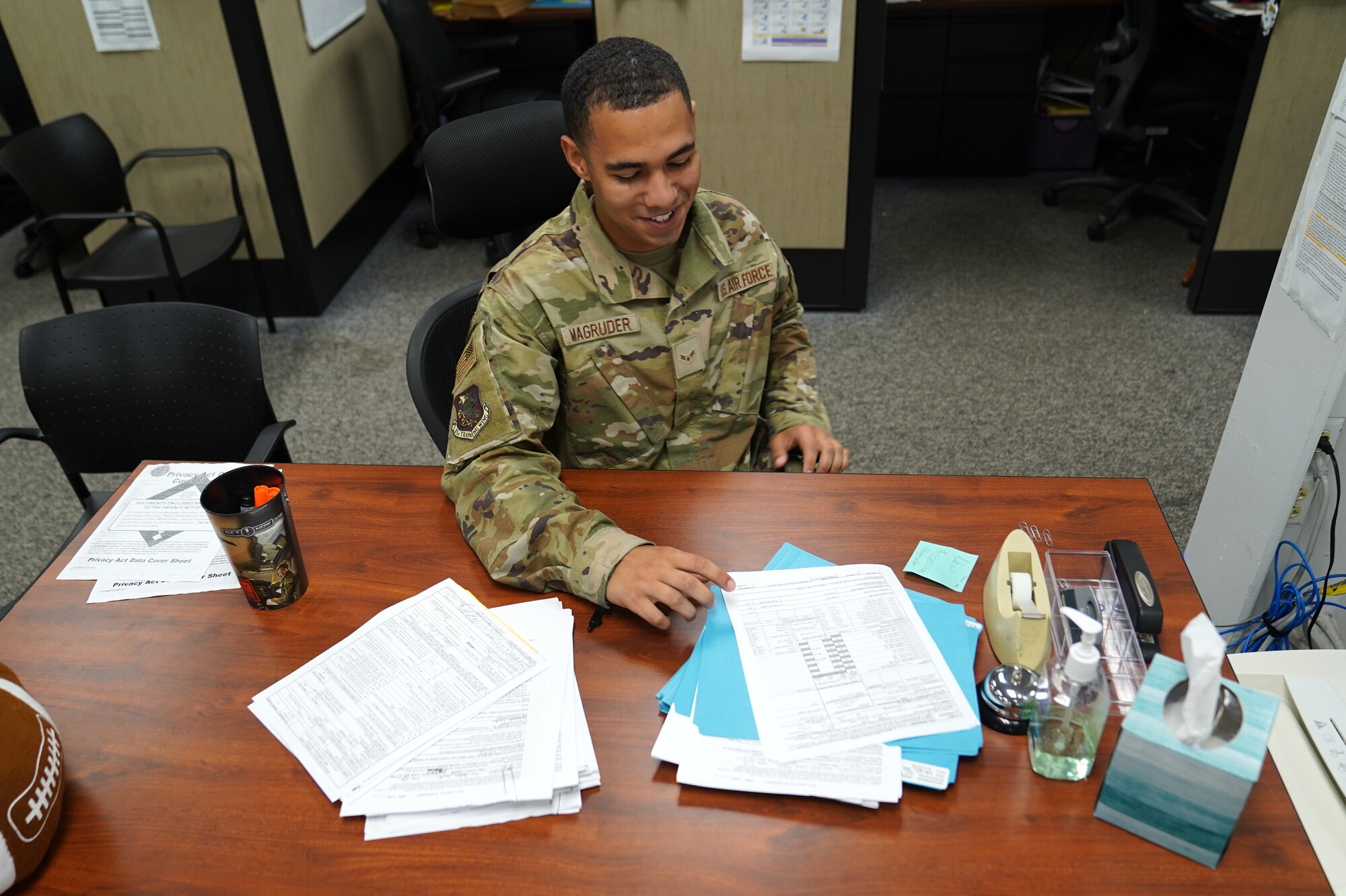 U.S. Air Force Airman 1st Class Noah Magruder, 81st Comptroller Squadron special actions technician, computes travel entitlements inside the Sablich Center at Keesler Air Force Base, Mississippi, July 28, 2021. From managing the finances of Keesler personnel to being a part of the Keesler Airman's Council and creating the Junior Enlisted Professional Enhancement Seminar, Magruder embraces his role as an Airman and acknowledges his impact on the mission. (U.S. Air Force photo by Senior Airman Seth Haddix)
