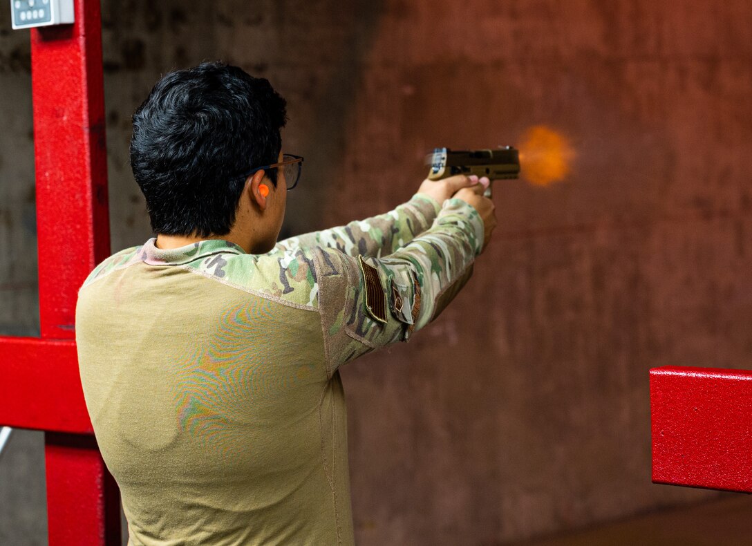 U.S. Air Force Staff Sgt. Elizabeth Pedroza, 56th Security Forces Squadron military working dog handler, fires an M18 carbine during a weapons qualification at the Combat Arms Training and Maintenance facility Aug. 3, 2021, at Luke Air Force Base, Arizona.