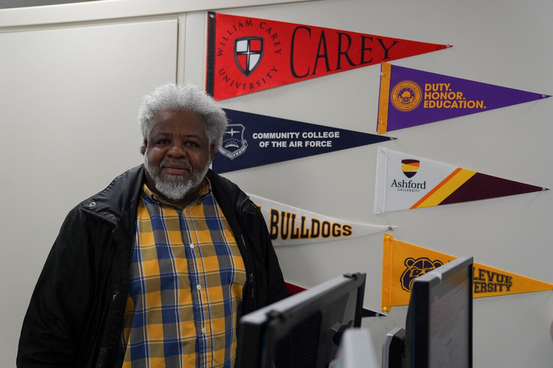 Louis Bridges, 81st Force Support Squadron education service specialist, poses in his office inside the Sablich Center at Keesler Air Force Base, Mississippi, Aug. 9, 2021. Bridges was one of 19 individuals nationwide to win the 2021 Veteran Champion of the Year award.