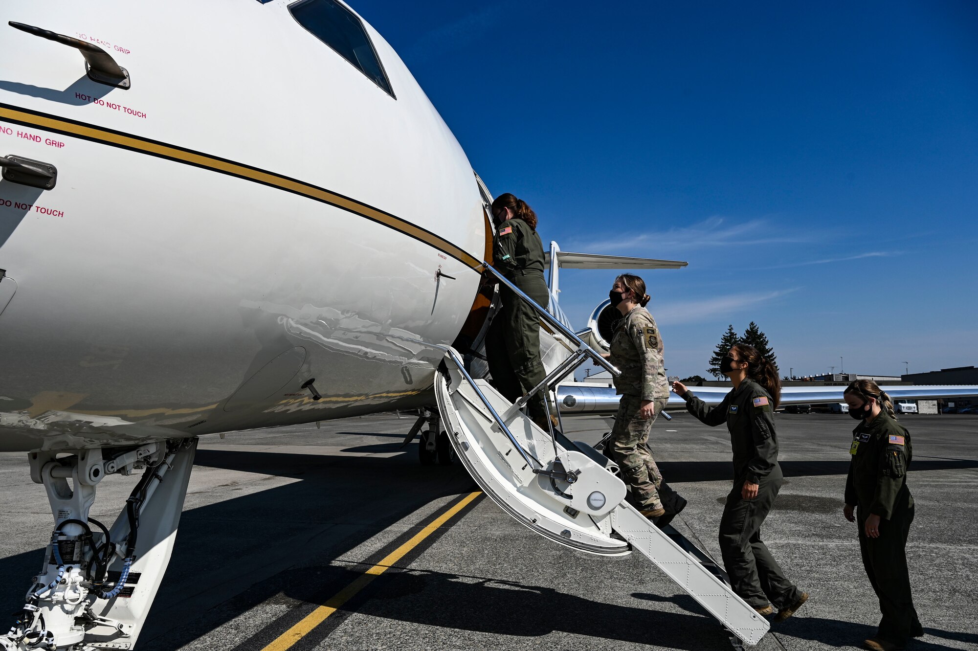 U.S. Air Force Airmen receive a tour of the C-37 as part of the 89th Airlift Wing Roadshow at Joint Base Lewis-McChord, Washington, Aug. 12, 2021. Based out of Joint Base Andrews, Maryland, the 89th AW provides global Special Air Mission airlift, logistics, aerial port services, and communications for the president, vice president, cabinet members, combatant commanders and other senior military and elected leaders as tasked by the White House, Air Force Chief of Staff and Air Mobility Command. (U.S. Air Force photo by Master Sgt. Julius Delos Reyes)