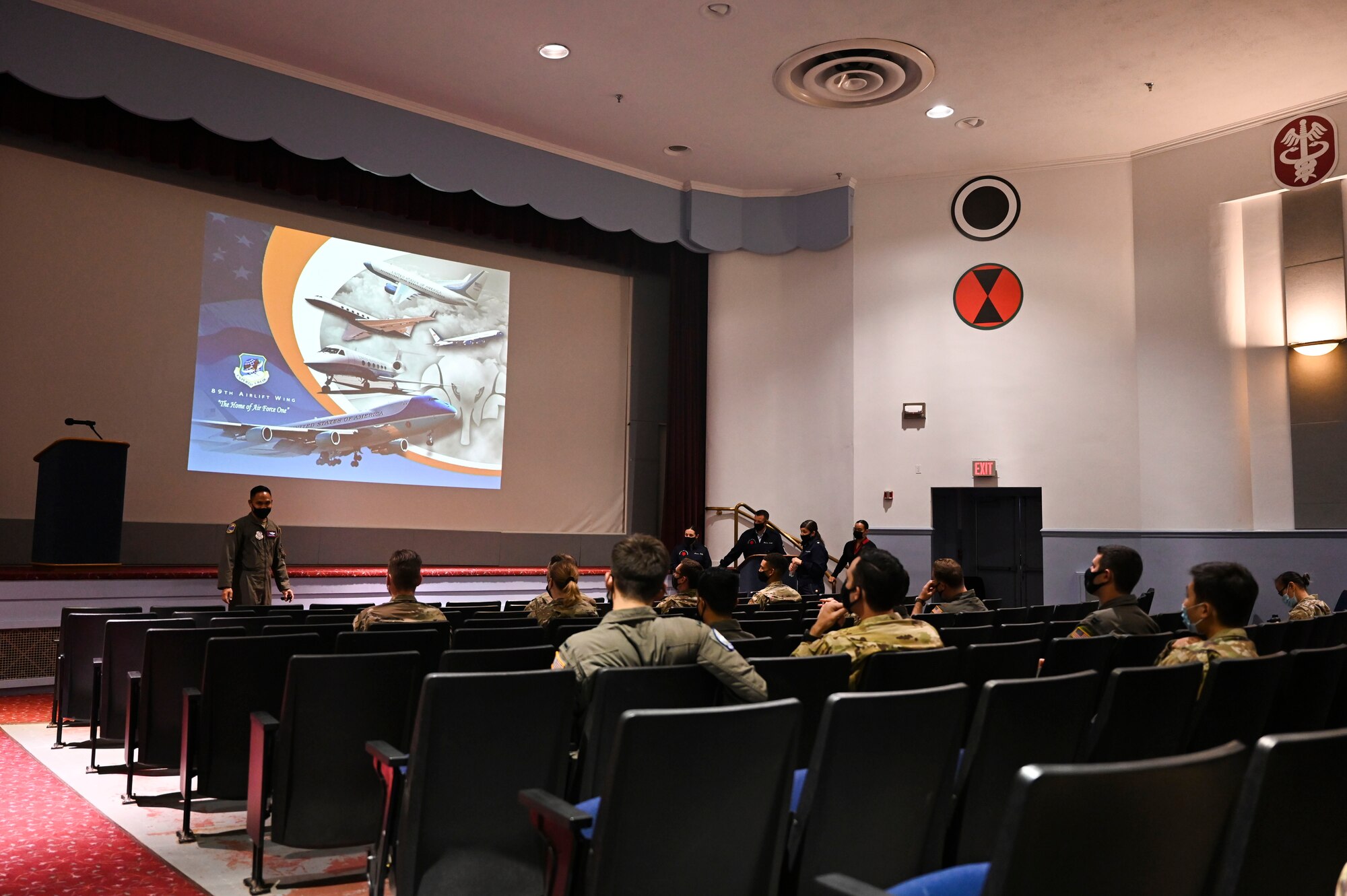 U.S. Air Force Maj. Aaron Payomo, 1st Airlift Squadron C-32 special air missions pilot, briefs Team McChord Airmen during the 89th Airlift Wing Roadshow at Joint Base Lewis-McChord, Washington, Aug. 12, 2021. The goal of the roadshow is to recruit pilots, flight engineers, communication system operators, flying crew chiefs and flight attendants. (U.S. Air Force photo by Master Sgt. Julius Delos Reyes)