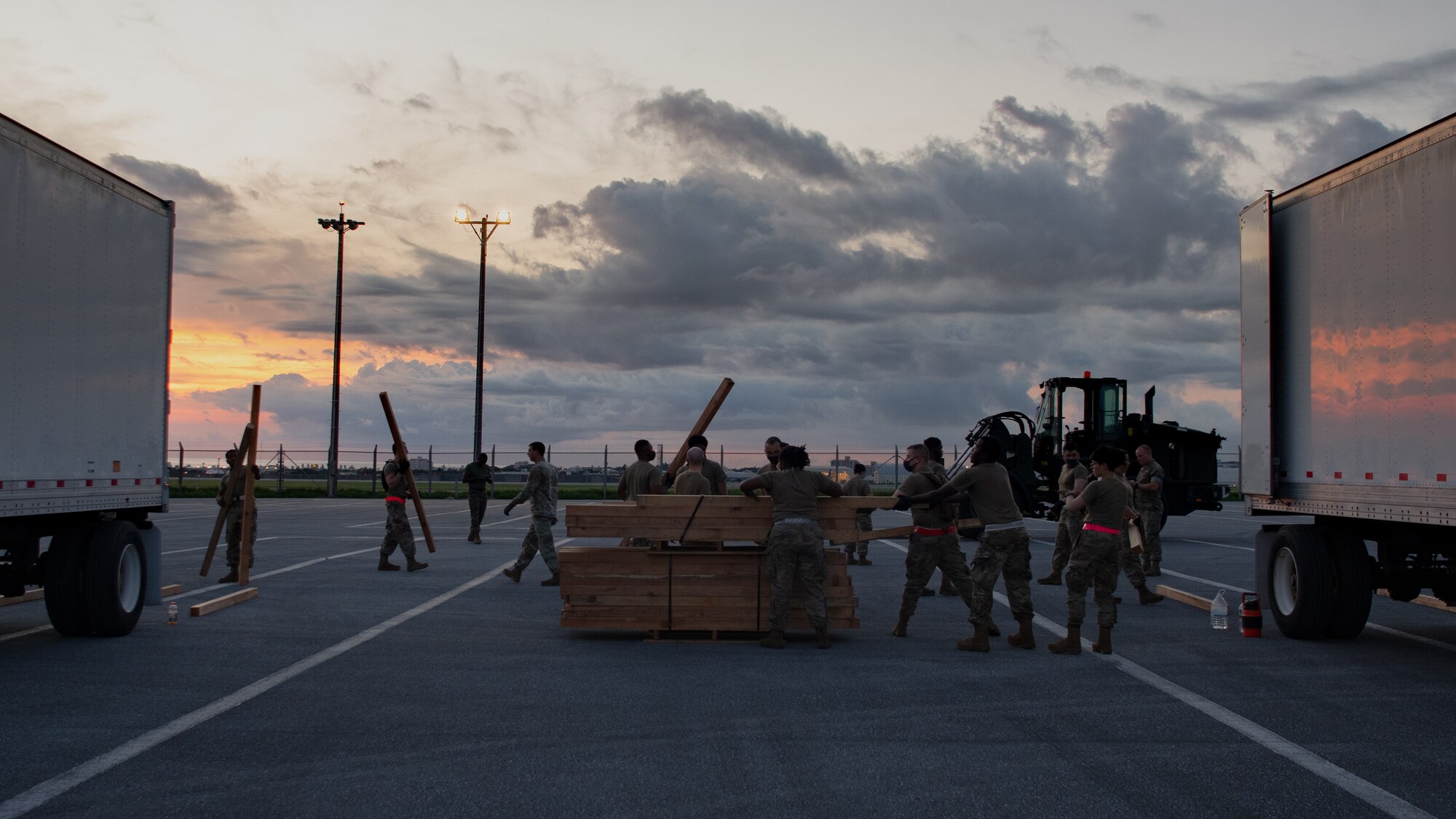 Pacific Air Force Air Postal Squadron Detachment 3 Airmen prepare boards for a shipment of mail at Kadena Air Base, Japan, July 31, 2021. During the holiday season mail deliveries to installations on Okinawa increase by over 20 percent daily. (U.S. Air Force photo by Airman 1st Class Stephen Pulter)