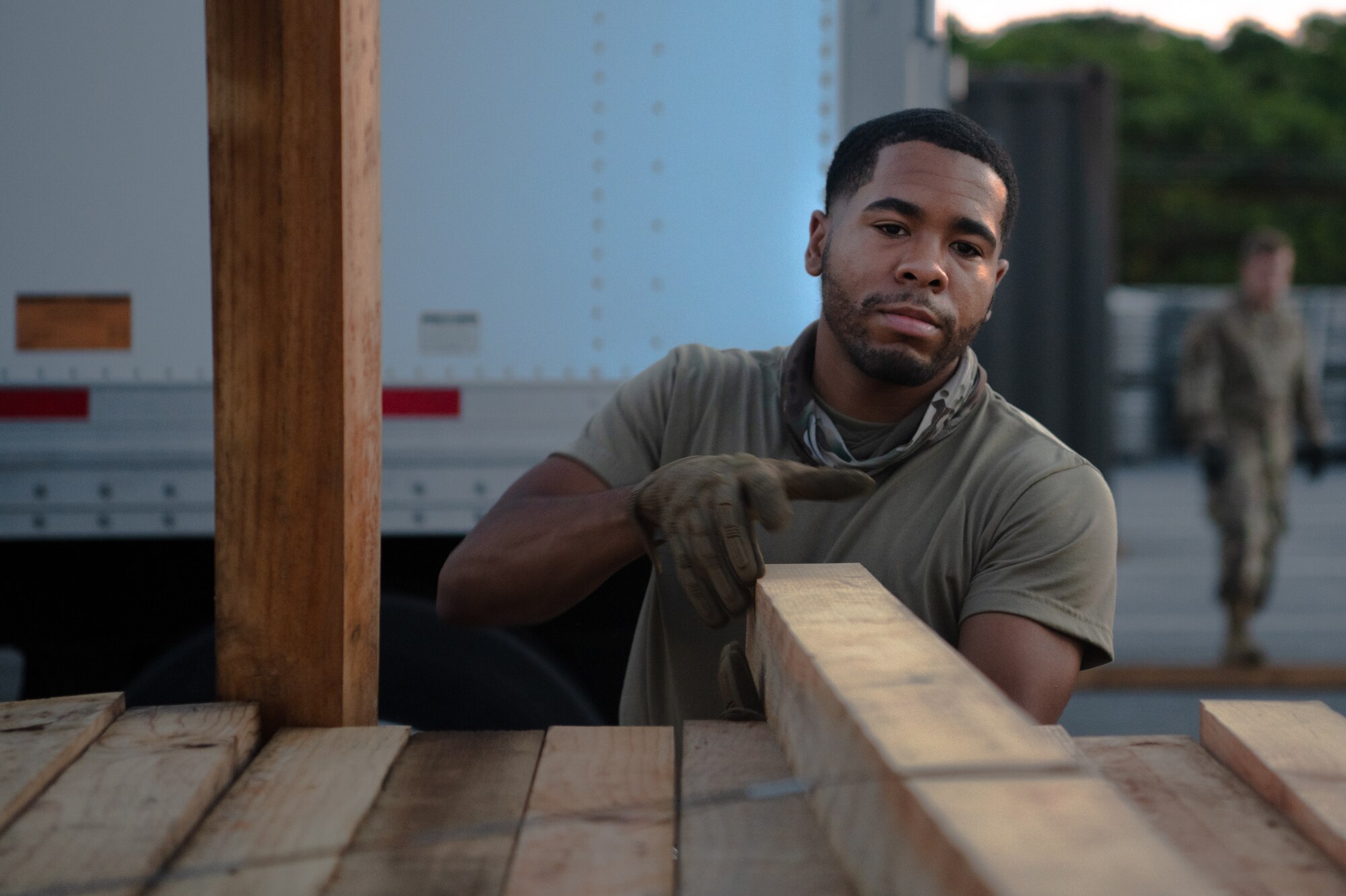 U.S. Air Force Senior Airman Tyrone Smith-Hasty, 18th Logistics Readiness Squadron ground transportation operator, prepares boards for a mail shipment at Kadena Air Base, Japan, July 31, 2021. Airmen from the 18th LRS move over 18.5-million tons of cargo and 114-thousand passengers annually. (U.S. Air Force photo by Airman 1st Class Stephen Pulter)