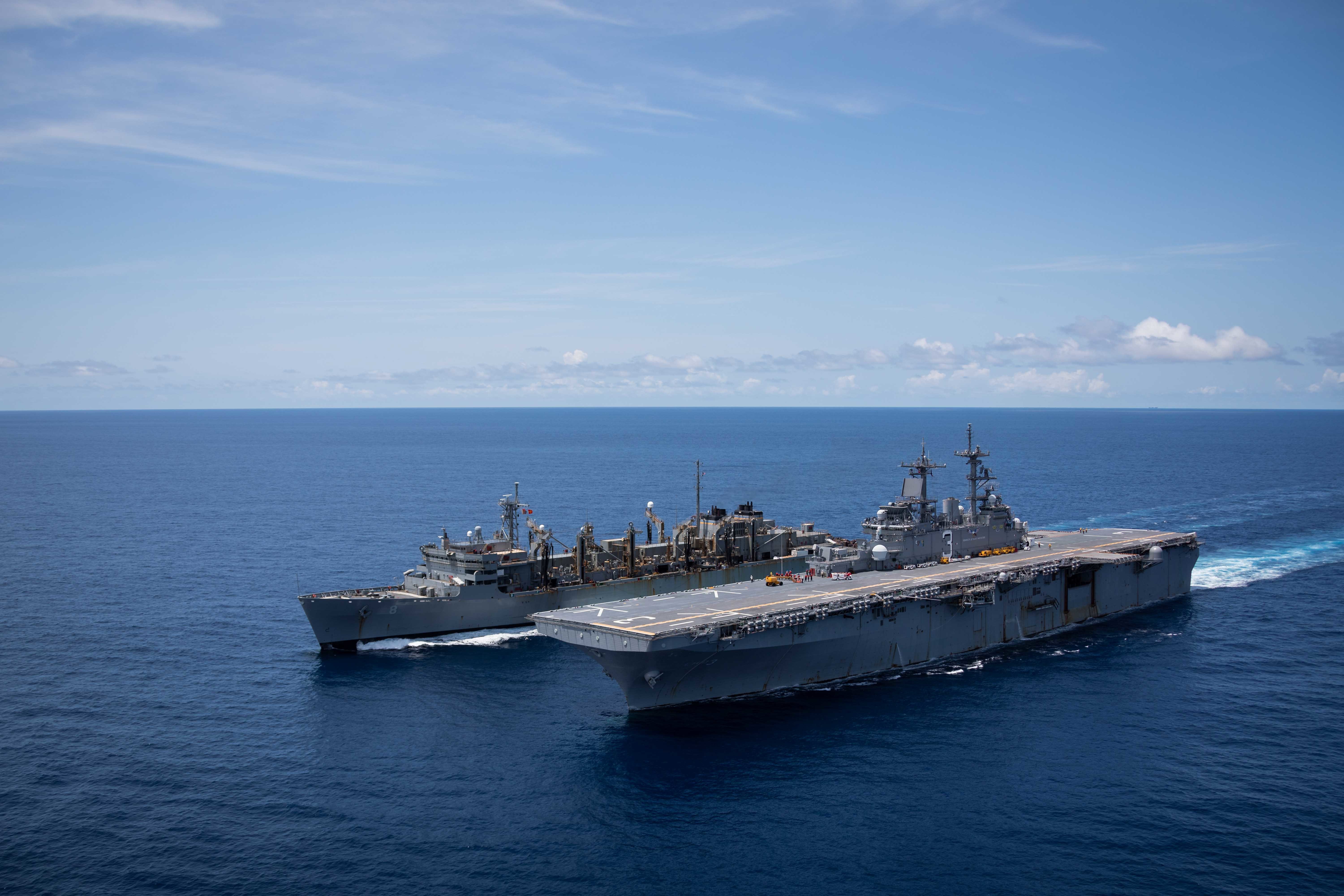 ATLANTIC OCEAN (Aug. 9, 2021) The Wasp-class amphibious assault ship USS Kearsarge (LHD 3) sails alongside the fast combat support ship USNS Arctic (T-AOE 8) to prepare for a replenishment-at-sea.