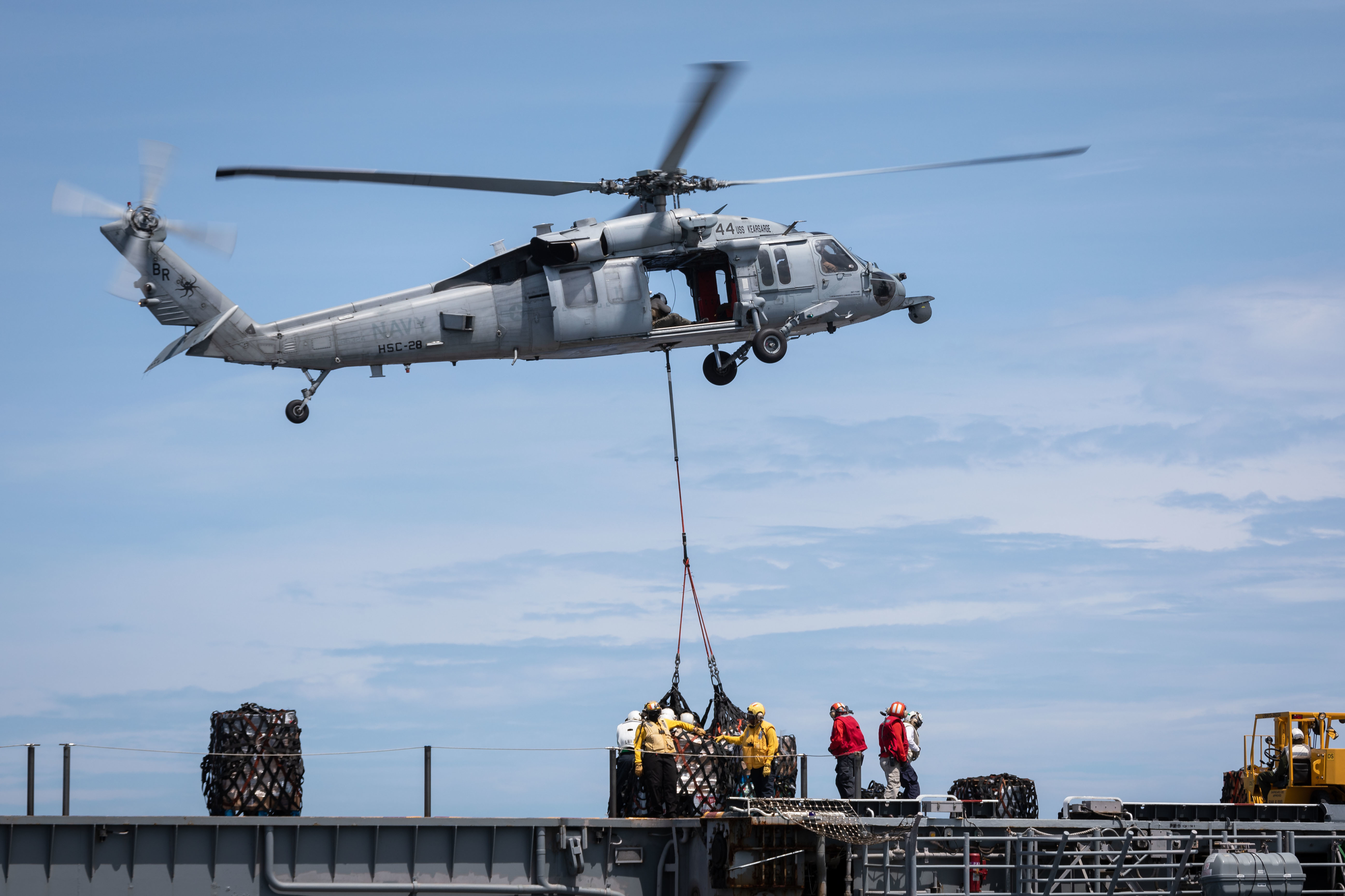USS Kearsarge (LHD 3) receives supplies from USNS Arctic (T-AOE 8).