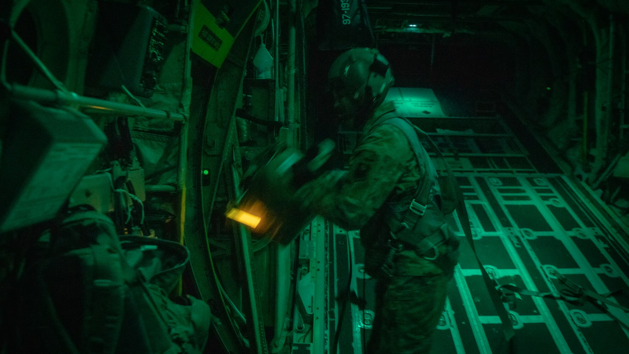 U.S. Air Force Tech. Sgt. John Richman, a 492nd Special Operations Training Group loadmaster, drops a thermal blood transport box during Operation Blood Rain near Eglin Range, Florida, Aug. 5, 2021.