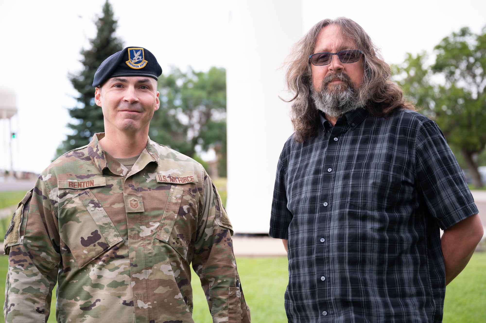 Master Sgt. Adam Benton, left, and Doug Van Dorn, right, 341st Missile Wing Installation Personnel Reliability Assurance Program monitors, pose for a photo Aug. 9, 2021, at Malmstrom Air Force Base, Mont.