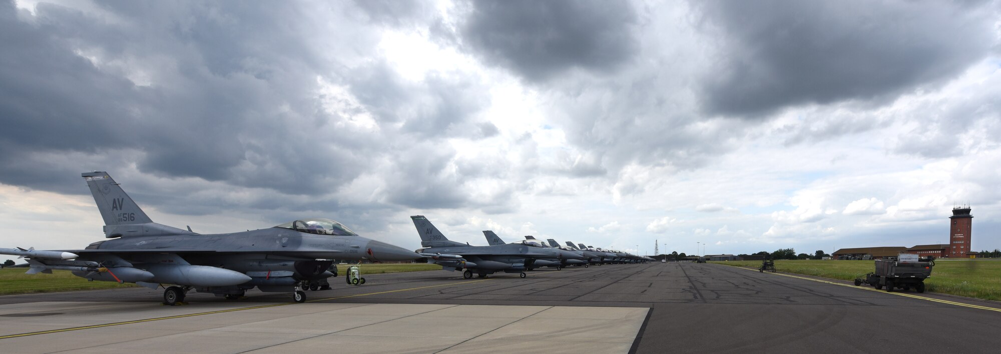 U.S. Air Force F-16 Fighting Falcon aircraft assigned to the 31st Fighter Wing, Aviano Air Base, Italy, sit on the flightline at Royal Air Force Mildenhall, England, Aug. 3, 2021. The F-16 is a compact, multi-role aircraft which is maneuverable and has proven itself in air-to-air combat and air-to-surface attack. (U.S. Air Force photo by Karen Abeyasekere)