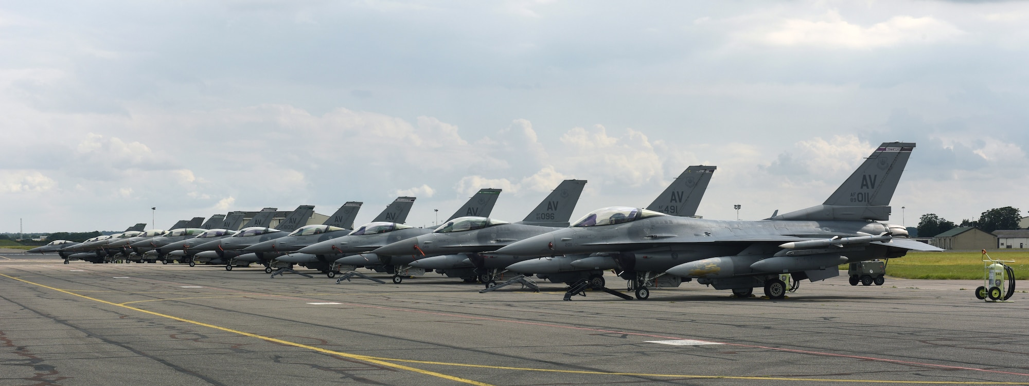 U.S. Air Force F-16 Fighting Falcon aircraft assigned to the 31st Fighter Wing, Aviano Air Base, Italy, sit on the flightline at Royal Air Force Mildenhall, England, Aug. 3, 2021. The F-16 is a compact, multi-role aircraft which is maneuverable and has proven itself in air-to-air combat and air-to-surface attack. (U.S. Air Force photo by Karen Abeyasekere)