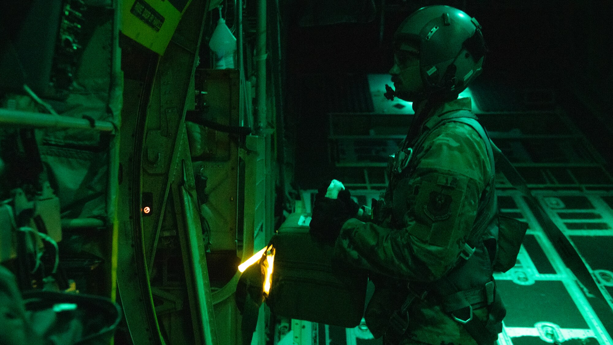 U.S. Air Force Tech. Sgt. John Richman, a 492nd Special Operations Training Group loadmaster, prepares to drop a thermal blood transport box during Operation Blood Rain near Eglin Range, Florida, Aug. 5, 2021.
