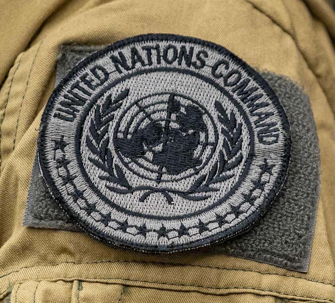 U.S. military officials stationed on Okinawa, foreign military and civilian personnel with United Nations Command Rear (UNC-R) and Government of Japan (GOJ) representatives discuss future plans on Marine Corps Air Station (MCAS) Futenma, Okinawa, Japan, Aug. 4, 2021. UNC-R and the Government of Japan visited MCAS Futenma to provide an opportunity for the UNC-R to meet the MCAS Futenma team and discuss local considerations that may impact future planning in establishing a possible UNC-R footprint. (U.S. Marine Corps photo by Lance Cpl. Jonathan A. Beauchamp)