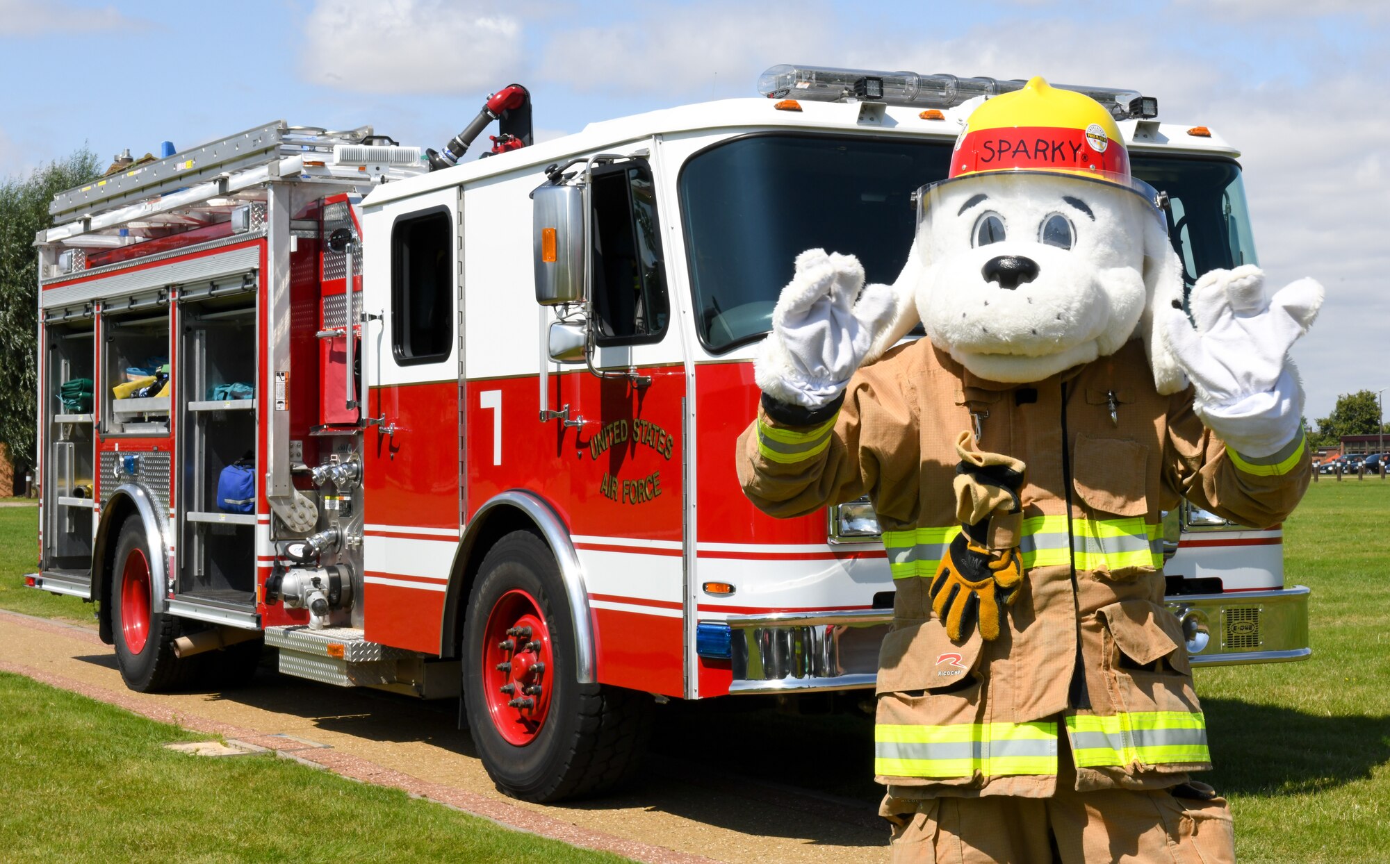 Sparky the Fire Dog poses for a photo at the “End of Lockdown” block party at Royal Air Force Alconbury, England, Aug. 11, 2021. Sparky and a few of the 423rd Civil Engineer Squadron firefighters educated military members and civilians on how they can help them in the event of an emergency. (U.S. Air Force photo by Senior Airman Gabrielle Winn)
