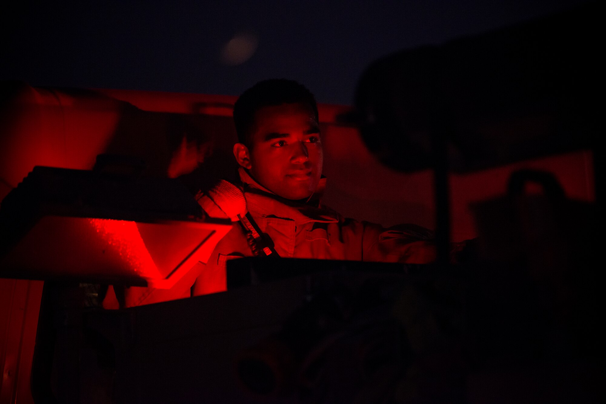 Airman 1st Class Matthew Bendorf, 379th Expeditionary Civil Engineer Squadron firefighter, operates a control panel on a firetruck during a training exercise August 10, 2021, at Al Udeid Air Base, Qatar.