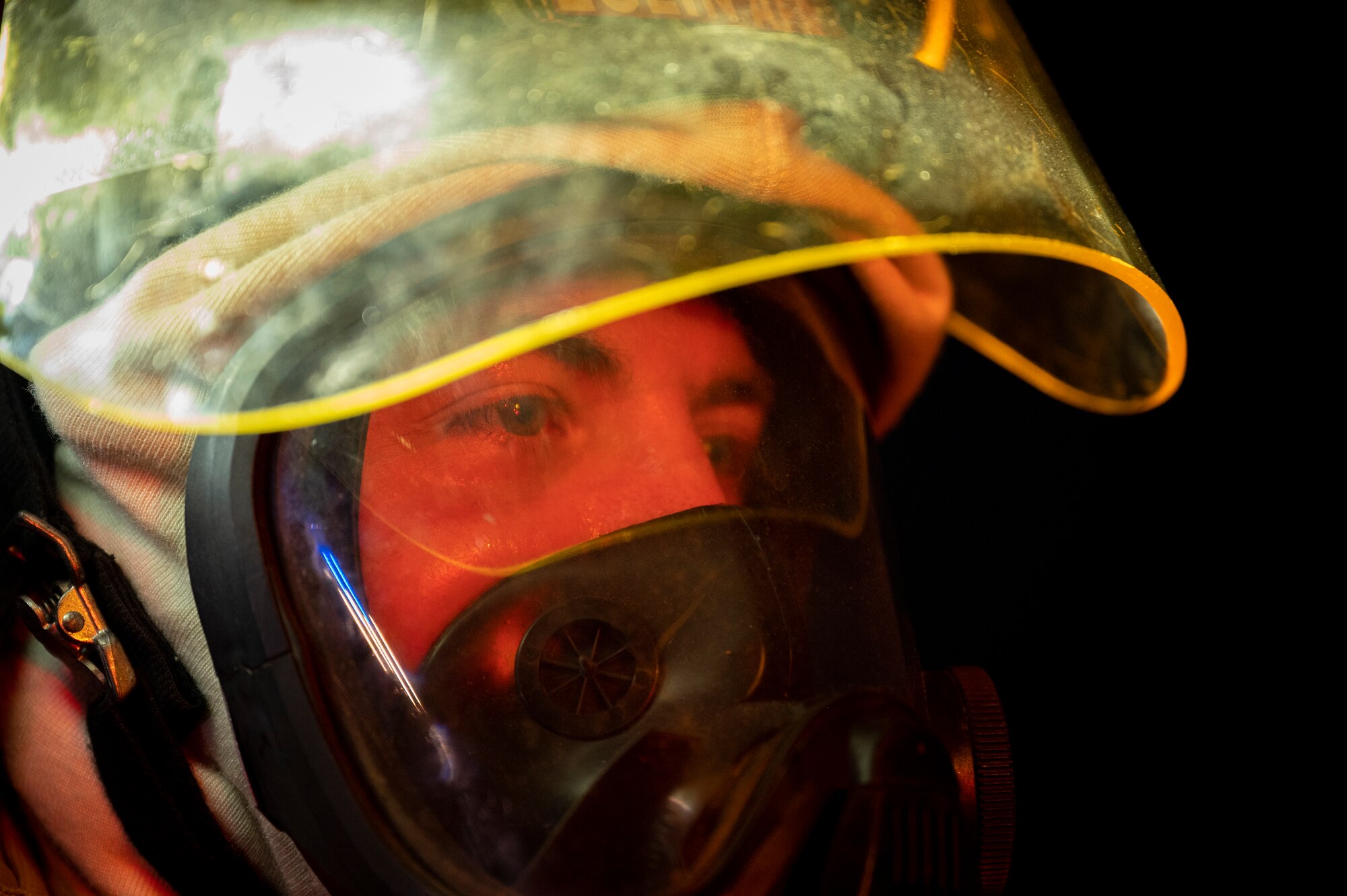 Staff Sgt. Joseph Shelton, 379th Expeditionary Civil Engineer Squadron station chief, directs fellow firefighters during a live-fire training August 10, 2021, at Al Udeid Air Base, Qatar.