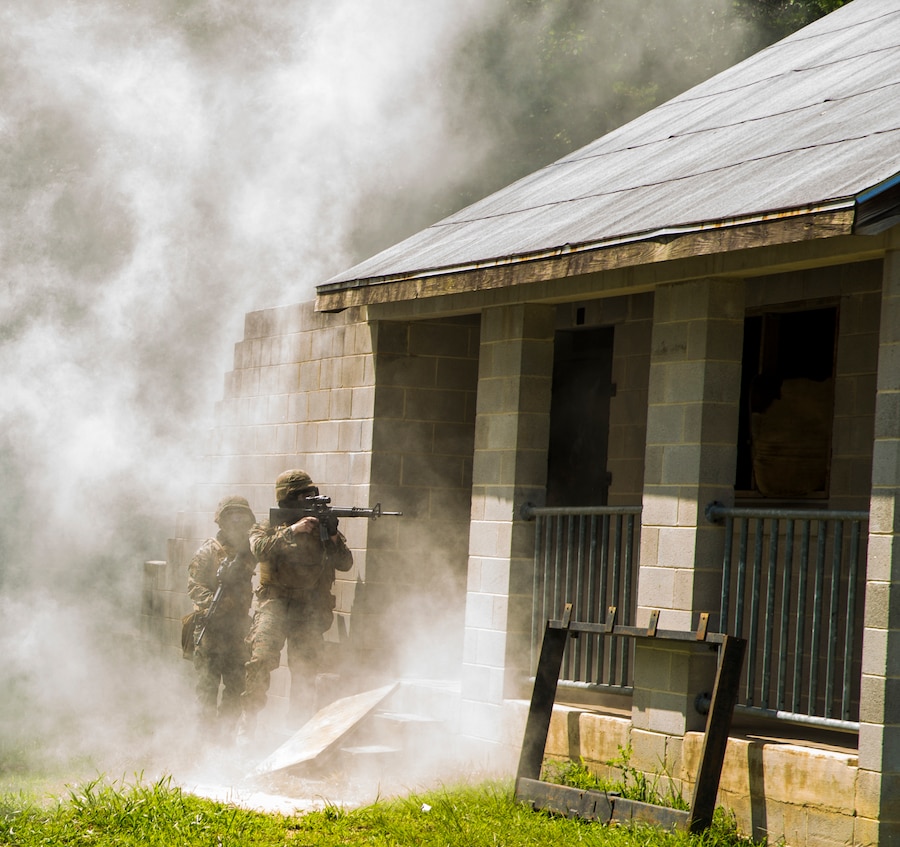 Marines with Alpha Company, Marine Barracks Washington, conduct military operations in urban terrain training at Marine Corps Base Quantico, Va., 11 July, 2021. The Marines learned, practiced, and implemented several different procedures: assaulting toward a building, clearing rooms and stairwells, and different techniques on navigating hallways and tight quarters. They finished the exercise with simulation ammunition and participated in notional squad versus squad engagements to better simulate a live urban environment. (U.S. Marine Corps photo by Lance Cpl. Allen Sanders)