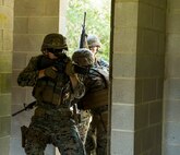 Marines with Alpha Company, Marine Barracks Washington, conduct military operations in urban terrain training at Marine Corps Base Quantico, Va., 11 July, 2021.