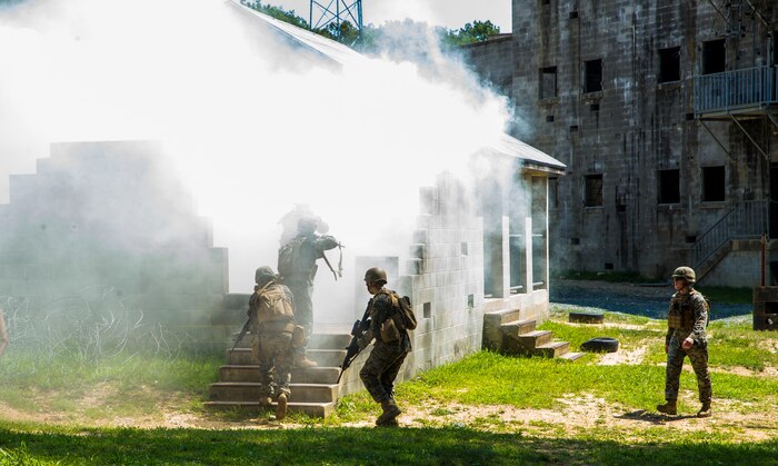 Marines with Alpha Company, Marine Barracks Washington, conduct military operations in urban terrain training at Marine Corps Base Quantico, Va., 11 July, 2021.