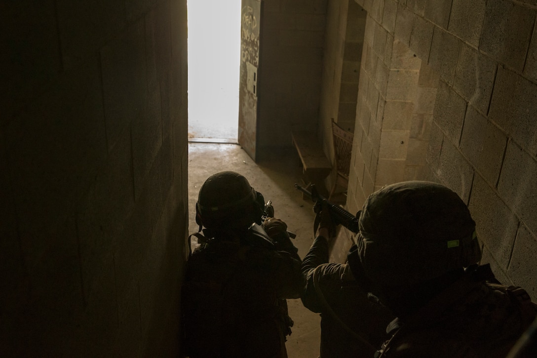 Marines with Alpha Company, Marine Barracks Washington, conduct military operations in urban terrain training at Marine Corps Base Quantico, Va., 11 July, 2021.
