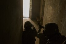 Marines with Alpha Company, Marine Barracks Washington, conduct military operations in urban terrain training at Marine Corps Base Quantico, Va., 11 July, 2021.