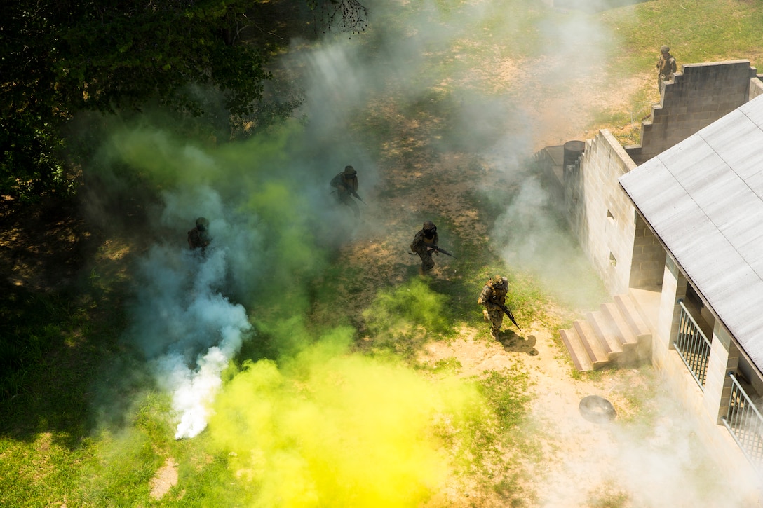 Marines with Alpha Company, Marine Barracks Washington, conduct military operations in urban terrain training at Marine Corps Base Quantico, Va., 11 July, 2021.