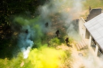Marines with Alpha Company, Marine Barracks Washington, conduct military operations in urban terrain training at Marine Corps Base Quantico, Va., 11 July, 2021.